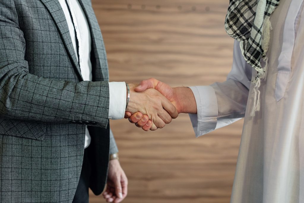 Two business partners shaking hands.